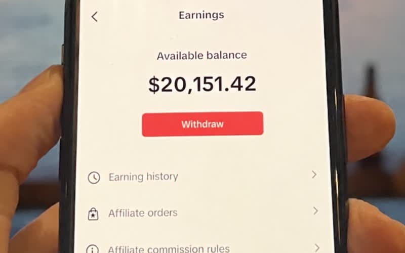 Phone showing an available affiliate balance of $20,151